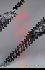 Back view of floral jacquard suit with structured jacket and slim pants