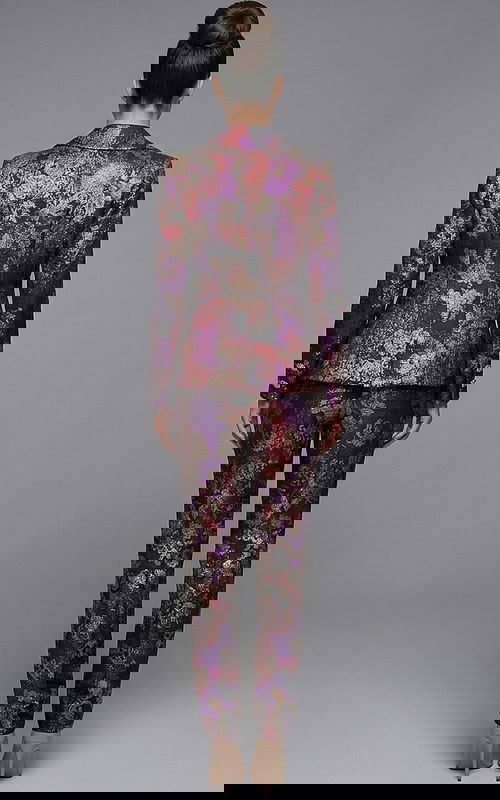 Back view of floral jacquard suit with structured jacket and slim pants