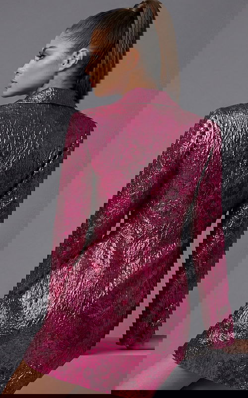 Back view of tailored metallic jacket showing textured fabric and clean seams