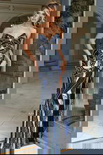 Glamorous beaded evening dress with strapless bodice and fitted shape