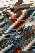 Black and blue sequin gown featuring intricate swirl beadwork