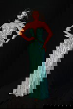 Fitted aqua sequin gown featuring radiant bead patterns and shimmering details