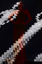 Sequined metallic gown featuring cutout sides and shimmering leaf accents