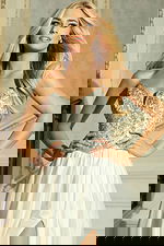 Flowing formal dress featuring crystal-embellished bodice and satin skirt