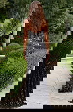 Black evening gown with detailed beadwork and elegant front slit