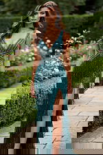 Side angle of deep V neck dress with side slit and textured fringe finish