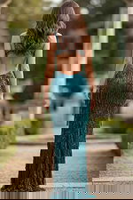 Back view of fitted gown with open back and layered beaded fringe detailing