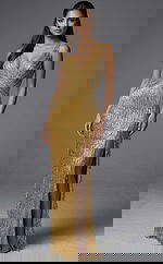 Fitted formal gown featuring intricate beadwork and high slit design