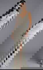 Elegant beaded evening gown with deep V neckline and fringe detailing