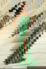 Model wearing strapless beaded gown with sweetheart neckline and high slit