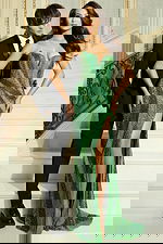 Front view of green embellished evening gown with fitted silhouette