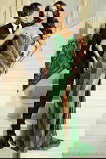 Front view of green embellished evening gown with fitted silhouette