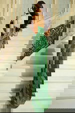 Back view of beaded strapless gown with floor-length train