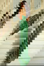 Back view of beaded strapless gown with floor-length train