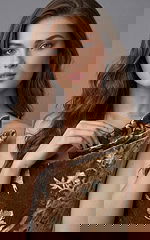 One shoulder velvet evening gown with floral brocade pattern shown from the front