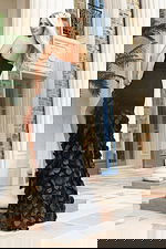 Black formal gown with dimensional dot embellishments and side