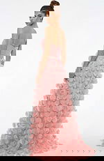 Back view of strapless gown with ruched bodice, beaded waist, and flowing skirt covered in soft circular appliqués