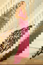 Elegant duo wearing sequined gold and pink gowns with deep V-necklines