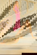 Floor-length beaded gowns featuring thigh-high slits and radiant sparkle