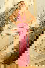 Models in glamorous evening gowns with sequin detailing and fitted silhouettes