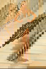 Gold sequin gown with halter neckline and high slit beside pink beaded dress