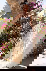 Strapless lace bridal gown with fitted column silhouette and floral texture