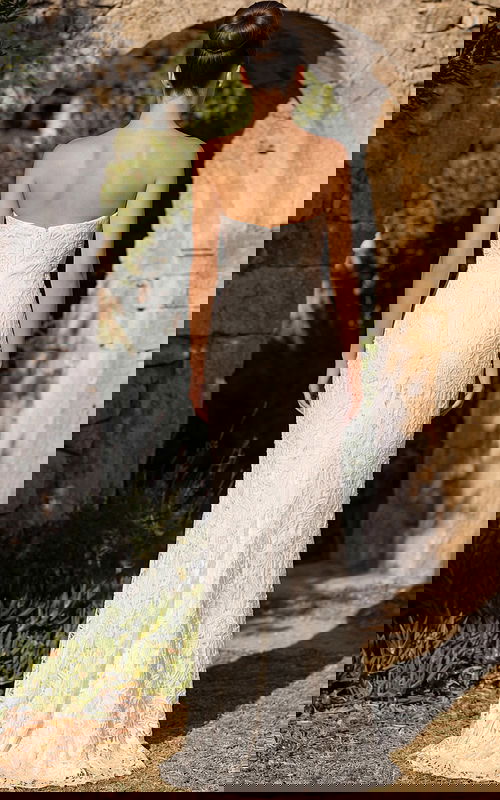 Back view of strapless lace wedding gown with smooth fitted finish