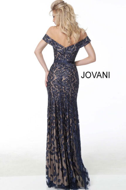 Model wearing Jovani 49634 navy lace dress, back view with open back.