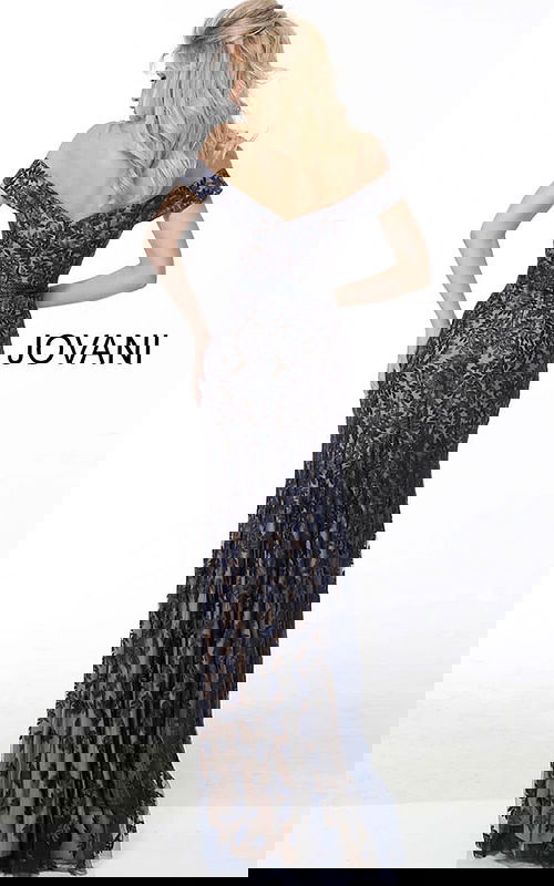 Model wearing Jovani 49634 navy lace dress, back view with open back.