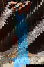 Jovani 49650 peacock blue V neck fitted prom dress with intricate crystal beading, tiered fringe detailing, and a sweep train