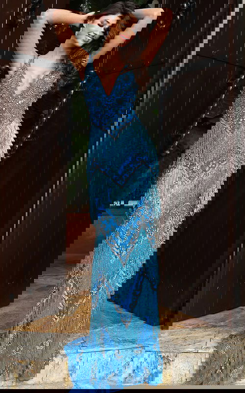 Jovani 49650 peacock blue V neck fitted prom dress with intricate crystal beading, tiered fringe detailing, and a sweep train