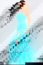 Floor-length strapless gown with fitted silhouette and cascading ruffled hem.