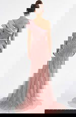 Back view of one shoulder beaded evening gown with sheer tulle train