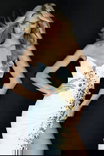 Elegant fitted gown with cascading gold beadwork and high slit