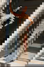 Front view of beaded gown with keyhole neckline and high slit