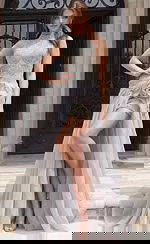 Front view of beaded halter style dress with high neckline, fitted silhouette, and sheer overskirt detail