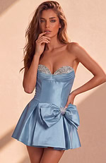 Form-fitting strapless dress with a cinched waist that transitions into a voluminous, flared skater-style skirt.