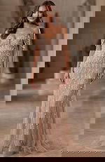 Embellished gown with draped beaded sleeves