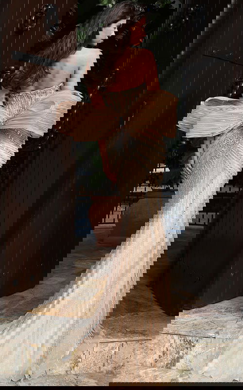 Jovani 47830 black strapless mini dress back view featuring oversized bow detail at the waist with dramatic floor length satin train