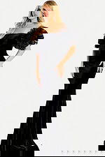 Off the shoulder velvet gown featuring dramatic ruffled tulle puff sleeves and a fitted mermaid silhouette for a glamorous statement look.