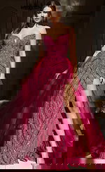 Strapless beaded gown with fitted bodice, high slit, and flowing tulle overskirt for a dramatic layered look