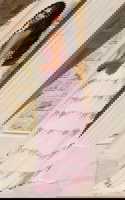 Flowing strapless gown with structured satin bodice and tiered layers