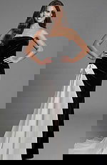 Strapless velvet gown with fitted silhouette and contrast draped panel