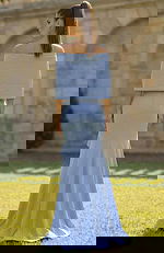 Back view of off shoulder gown with smooth fitted skirt and flared hem