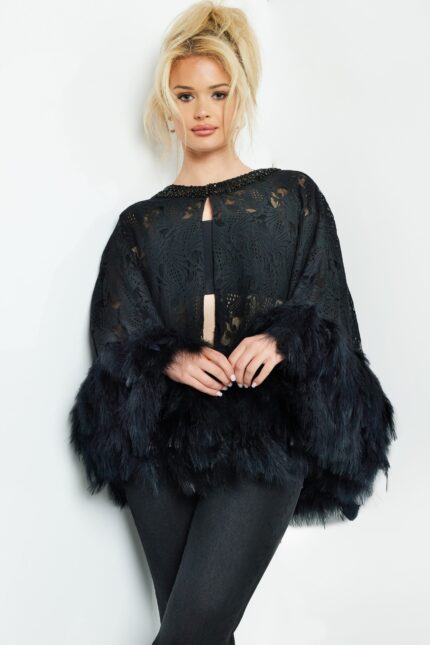 Model wearing Jovani 50364 black dress with lace overlay and feathered trim, front view.