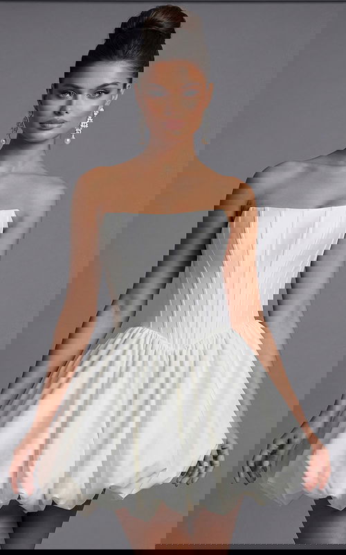 Strapless corset dress with structured bodice and voluminous bubble hem silhouette