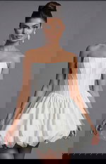 Strapless corset dress with structured bodice and voluminous bubble hem silhouette