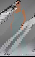 Fitted sleeveless jumpsuit with ruffled shoulder straps and wide leg silhouette