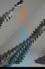 Brocade mermaid gown with fitted waist and dramatic flare back view