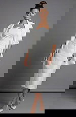 Front view of strapless white evening dress with structured waist detail